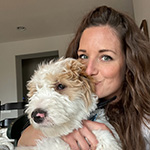 Primary Pet Care client Carrie with her dog.